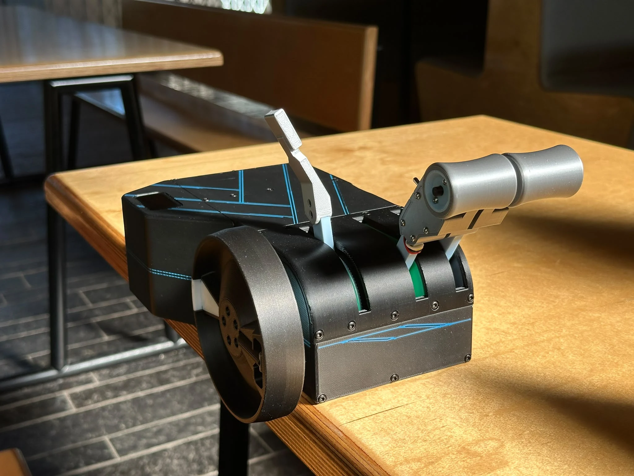 ThrottleSync on a desk, showing its two independent throttle levers, speed brake lever and trim wheel
